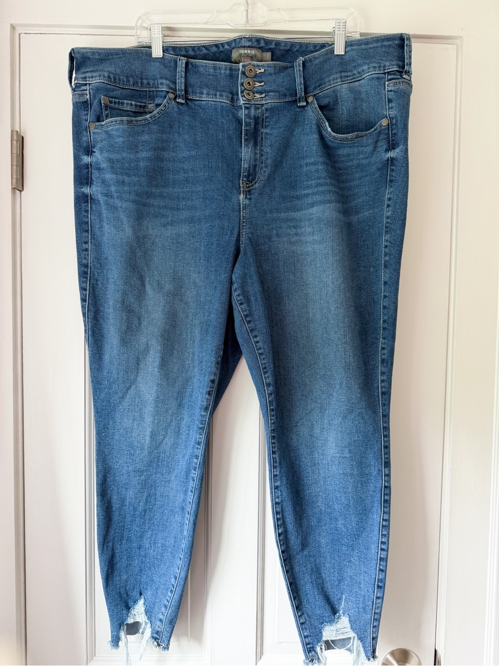 Torrid 24R Mid Wash Blue Distressed Hem Skinny Jeans